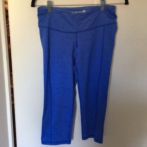 Cropped, blue workout pants with small key pocket